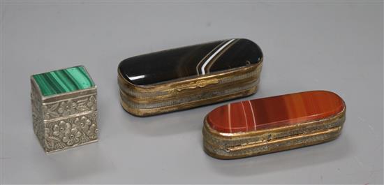 A sterling silver and malachite pill box and two 19th century gilt metal and agate boxes.